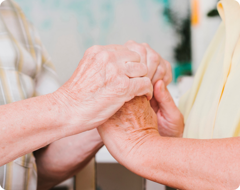 Early-stage Parkinson's disease, where a senior man is experiencing hand and joint pain at home.