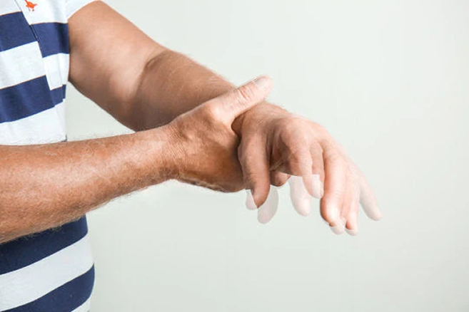 Tremor Management Through Wearable Devices: Investigating a Non-Pharmaceutical and Non-Surgical Solution