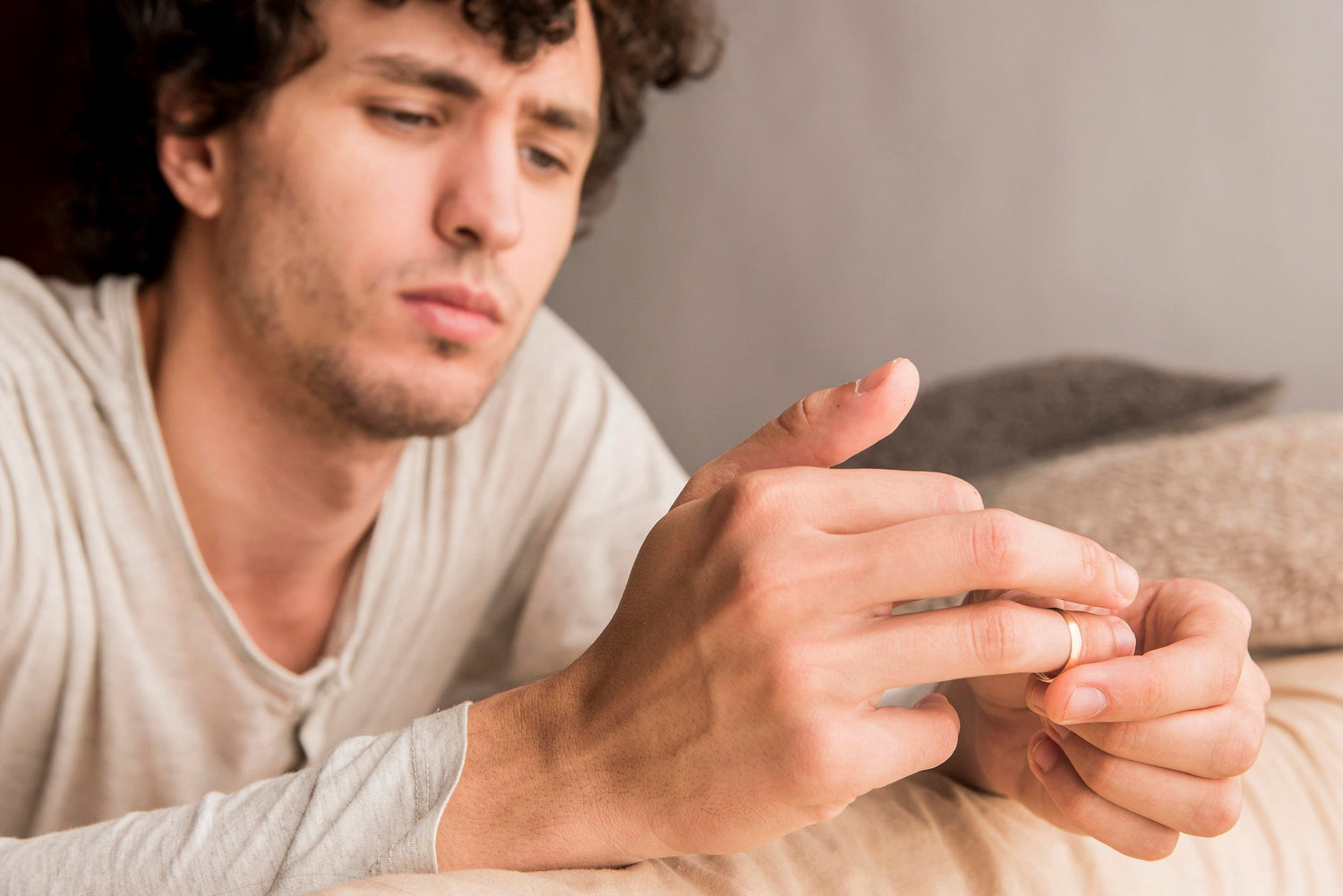 Man frustrated by hand tremors.